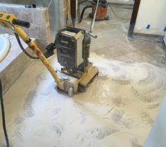 Large grinder grinding travertine tiles